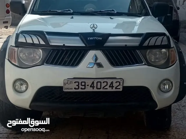 ميتسوبيشي l200 ابيض 4*4 بحاله ممتازه