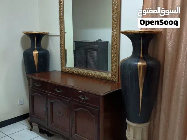 Solid wooden sideboard/console with large gold-framed mirror/Home Decor Vases