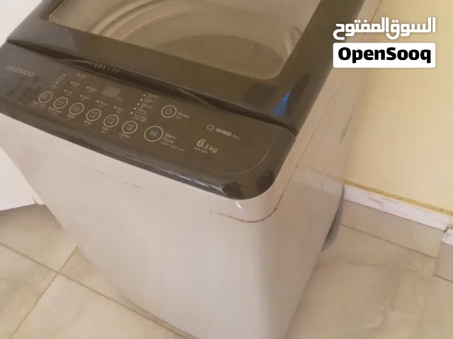غسالة داو 6.5كيلو مستعملة فيها قبقبة . شغالة لاكن تقبقب