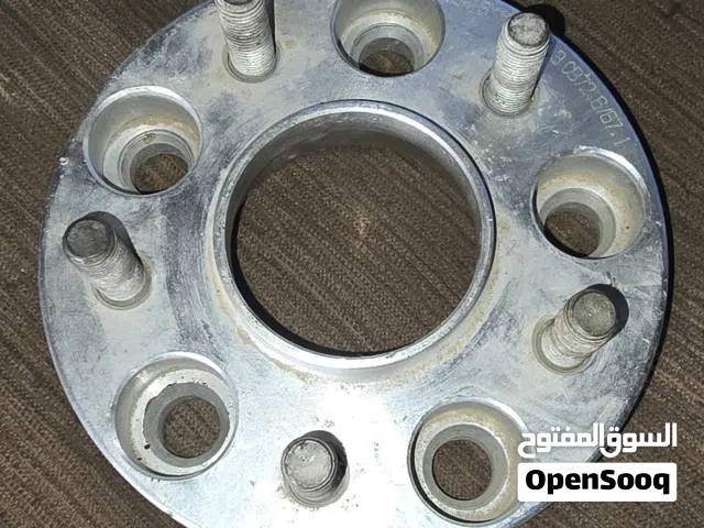 مُحوّل ومباعد عجلات "الفلنجة" أو "التكنة".