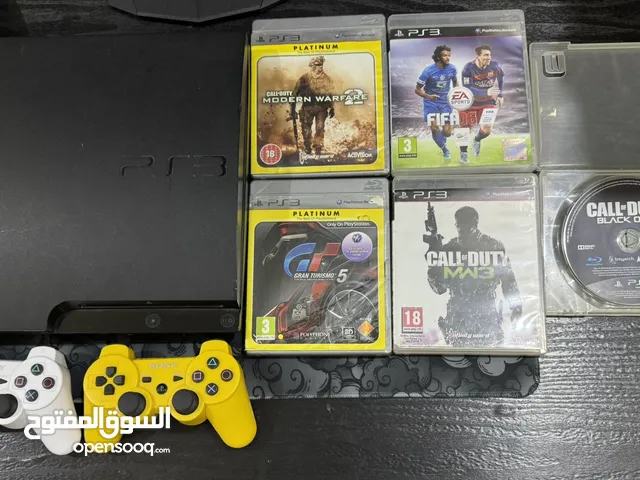PS3 slim (opened) with 2 controllers and 5 games