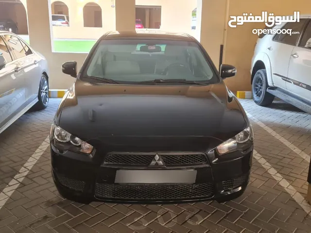 Mitsubishi Lancer 2015 – GCC Specs - First owner, lady use - Accident free -New tires and battery