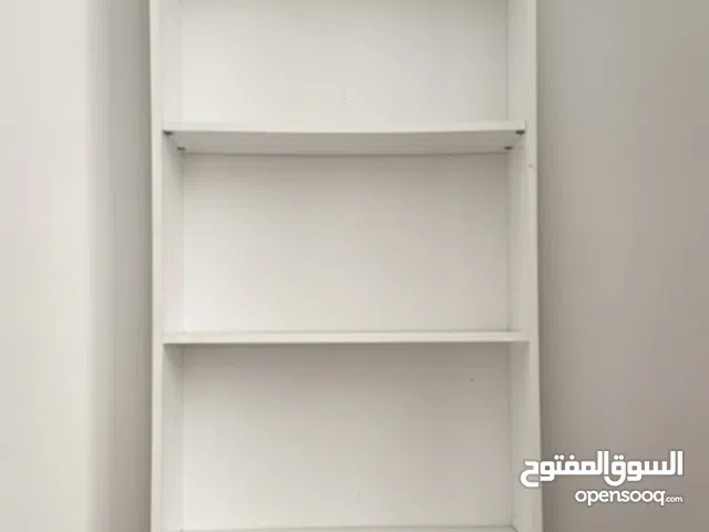 Used IKEA white 5-shelf bookcase, slim design, a few light scratches, sturdy.