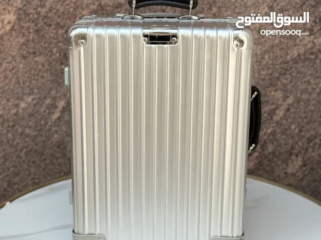 Rimowa aluminum and leather handle travel luggage