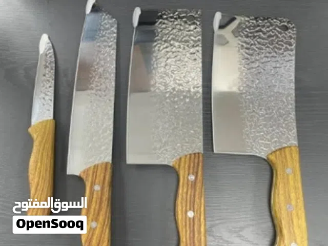 4-piece kitchen knife set featuring textured hammered blades and wooden handles.