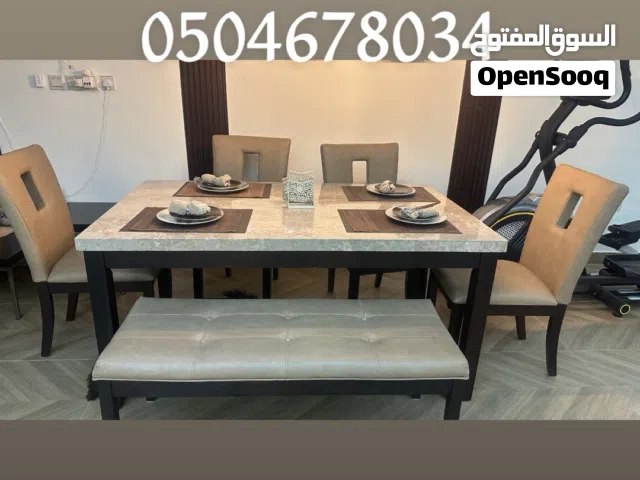 طاوله طعام من سنتر هوم رخام وكراسي جلد عدد7 اشخاص نظيفه