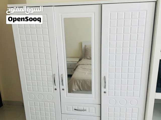 Elegant White Bedroom Wardrobe with Mirror & Unique Texture