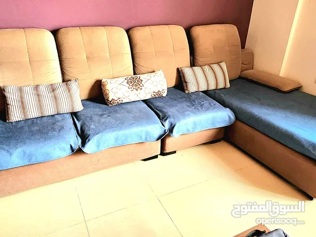 L shape bed sofa with very good condition with side hand rest cusions