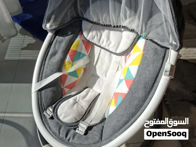 Gentle Rocking Baby Bouncer with Soothing Features like bluetooth connectivity and remote control.