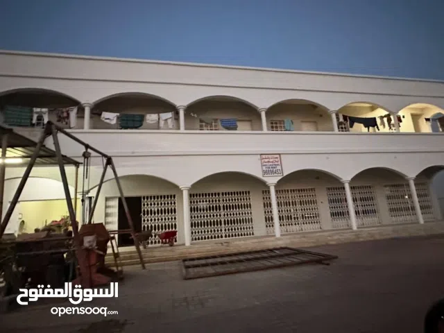 مبنى ومحلات وشقق للايجار لوى الصناعية