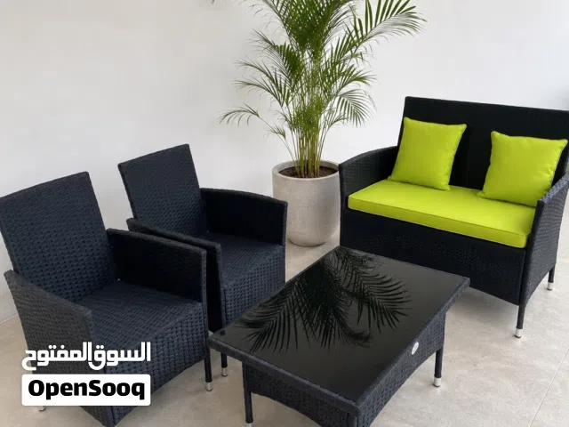 4-piece Outdoor Rattan Patio Sofa Set with Table and Cushions