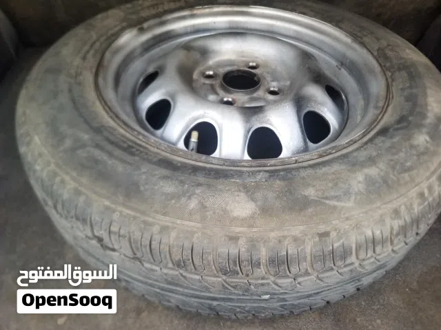اطارات مع الطاوات مقاس 14 شبه جديد