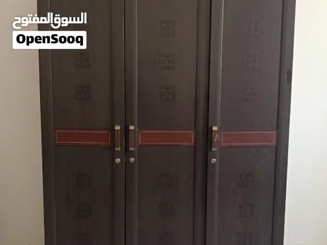 Spacious dark wooden 3 door wardrobe