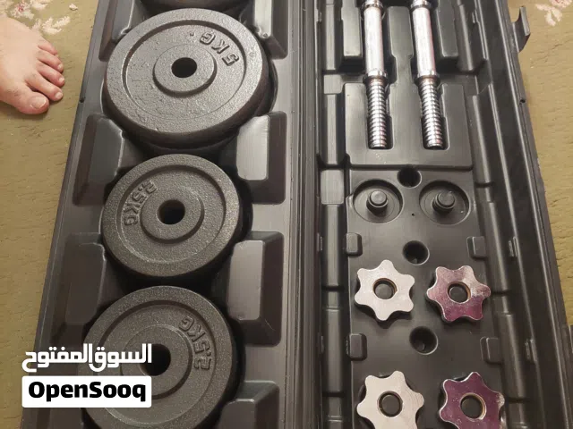 شنطه أوزان حديد 50 كجم جديده فيها طارات بأوزان مختلفه + عدد 2 دامبل للبيع