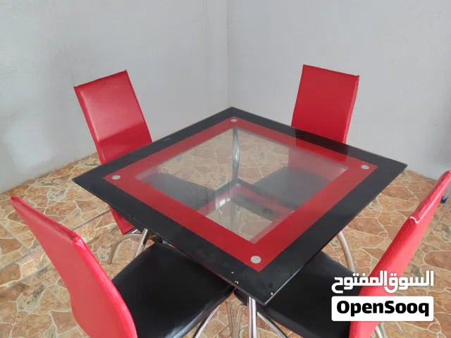 طاولة طعام زجاج وكراسي جلد للبيع