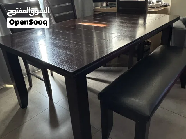 Wooden and leather tables and seats for sale