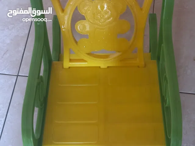 كرسي أطفال بلاستيك هزاز ( من عمر سنه إلى ثلاث سنوات ) لون اصفر واخضر