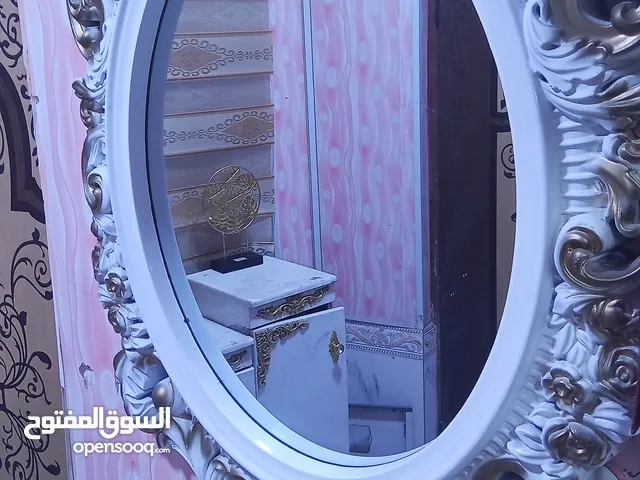 جزامة أحذية ومرايا