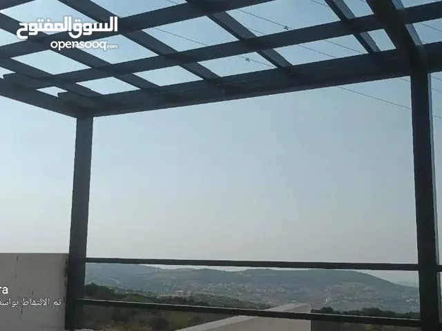 ارض وبيت بام الينابيع /عجلون باطلاله مميزه ومحاطه بالغابات والاكواخ السياحيه للبيع تصلح للاستثمار