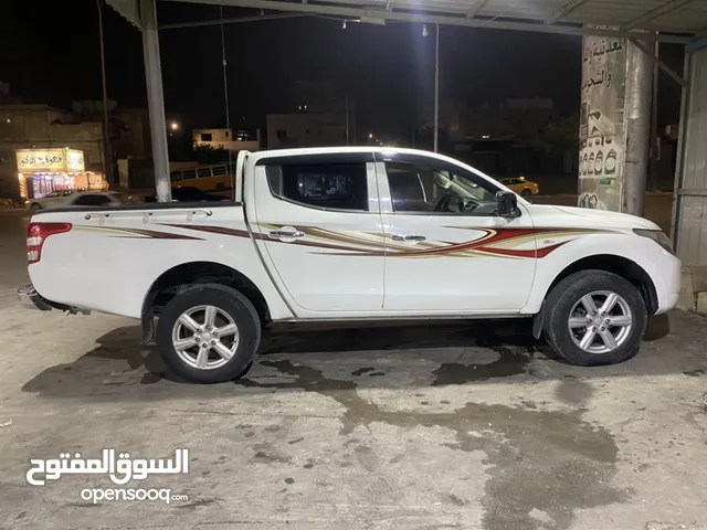 ميتسوبيشي L200 فحص كامل باقل سعر بالسوق سياره وكالة فحص كامل وليست بحاجه صيانه والسياره حبه نظيفه...