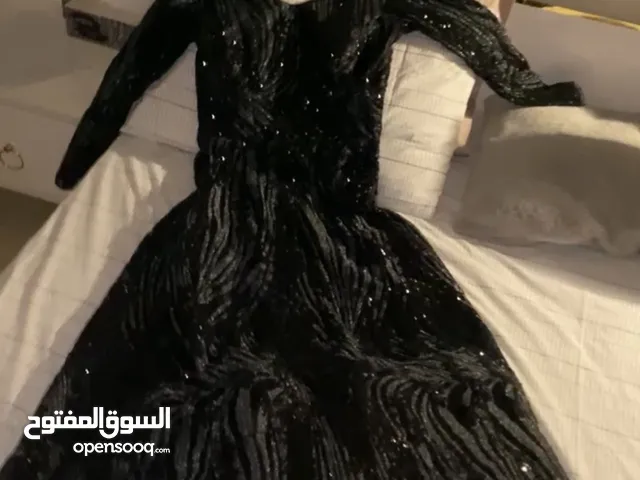 Black fancy dress full sleeves elegant shiny with gems all over the dress.