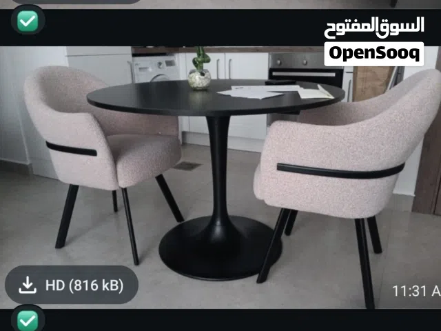 two table chairs and one table
