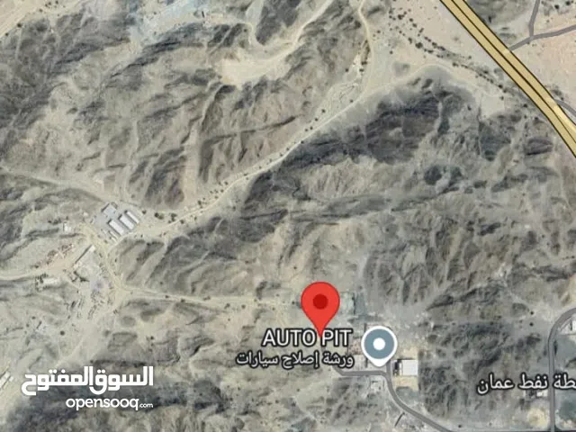 للايجار ارض صناعية ممتازة مسورة في العامرات في العتكية خلف محطة نفط عمان