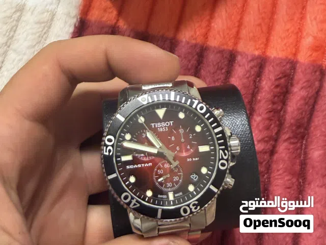 ساعة tissot معه كل اغراضها الساعة كرونوغراف و ضد الماء 300 متر