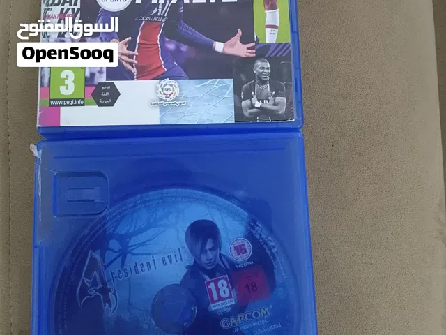 صباح الخير شريطين رزدنت ايفل 4 نسخه2005 وفيفا 21 هنا الاثنين مع بعضهم بي 180 مش كل وحده بروحه