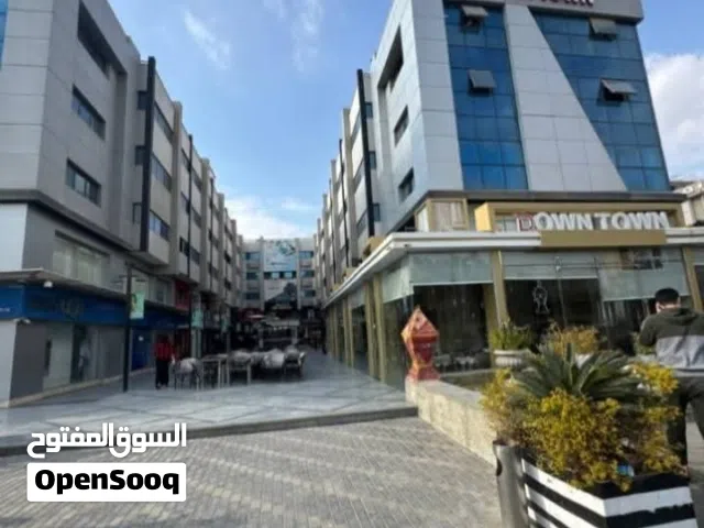 محل 100م دورين للإيجار في داون تاون الشيخ زايد بجوار QNB