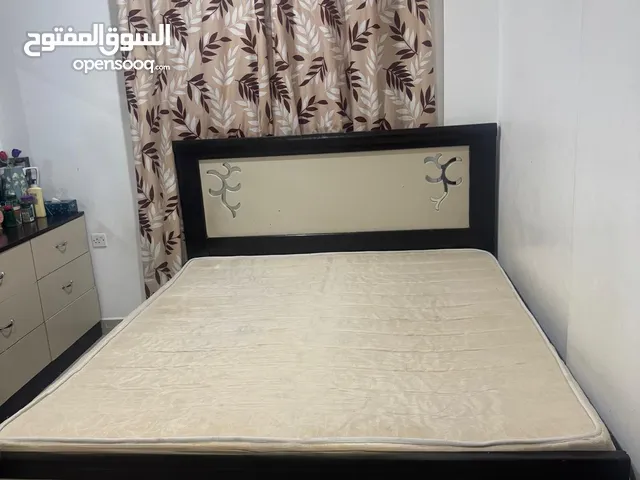 Bed for sale at a reasonable price along with dressing table and cupboard
