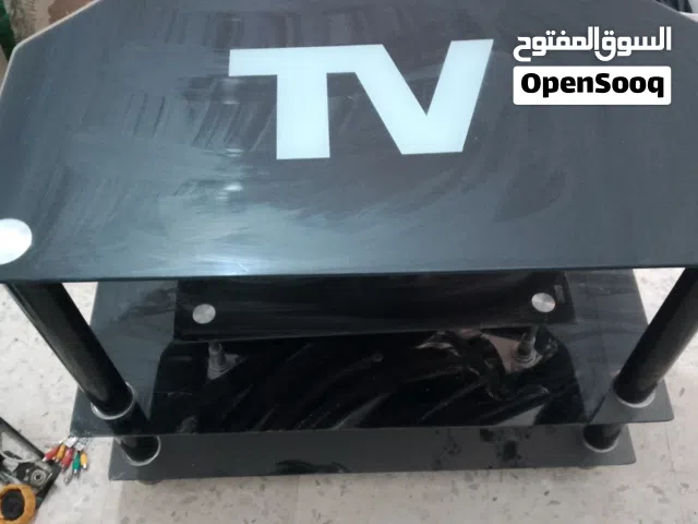 طاولة TV من الزجاج