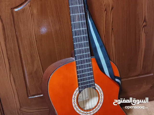 جيتار نوع kapok استعمال اسبوع + حزام + كابو جديد استعمال اسبوع فقط .....................
