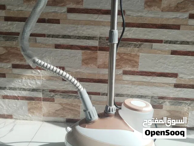 مكواة بخاري  و تنور كهربائي