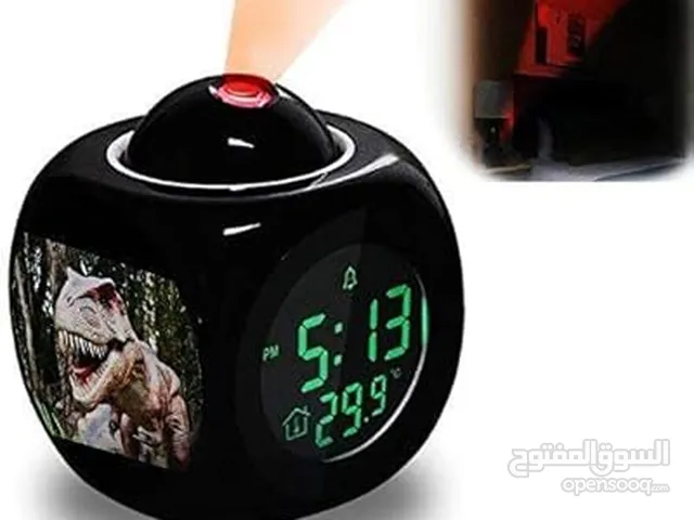 A cube-shaped digital alarm clock that displays the time and temperature, and includes a projector t