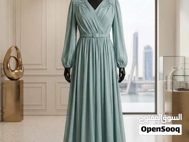 فستان سهرة فيروزي مع لمعه تجنن وطويل بلمسة فخامة تصميم راقي