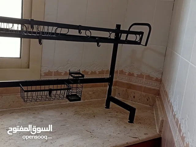 حاملة اطباق معدن اللون الاسود مع كامل الاكسسوارات