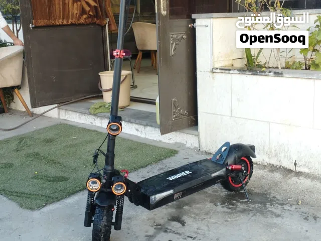 سكوتر كهربائي winner  بحال الوكاله للبيع  سرعته 70 كيلو متر بالساعة معاه شاحنة 56 ڤولت اقرء الوصف