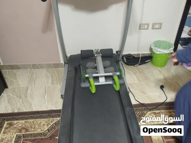 سير جرى وجهاز تمرين البطن