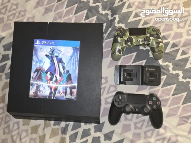 PS4 with controllers and games