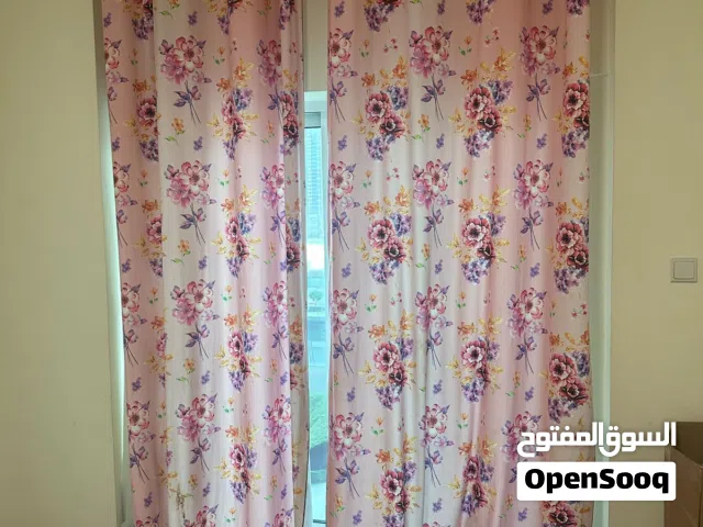 Pair of pink floral eyelet curtains - good condition