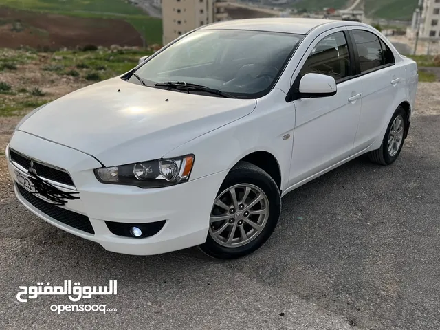 بسعر مغري ميتسوبيشي لانسر فراشه 2014 gls لون ابيض بحاله ممتازه للبيع