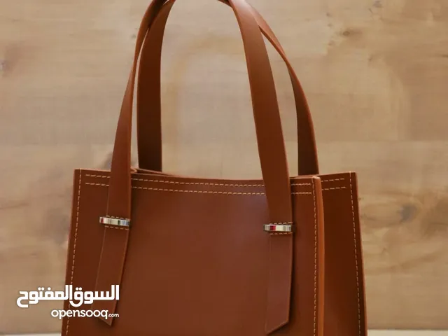 حقيبة مجلّسة جلد طبيعي نسائية