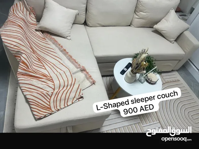 L-Shaped sleeper couch with 2x pillows