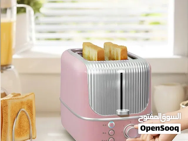 حمّاصة خبز كهربائية لشريحتين (2-Slice Toaster) بلون وردي وتصميم ريترو مميز، تبلغ قدرتها الكهربائ
