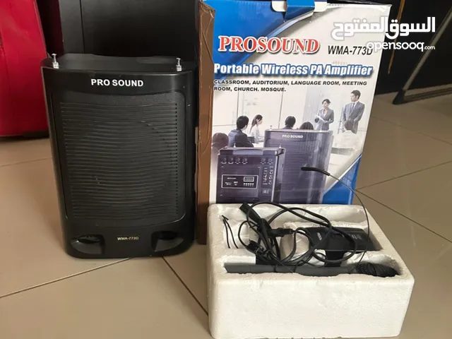 Speaker with wireless microphones