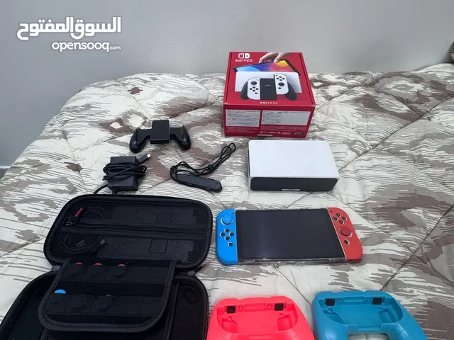 Used nintendo switch oled full bundle with 512gb with 2 cases