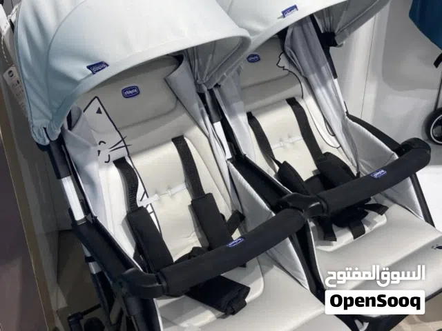 عربة أطفال توأم