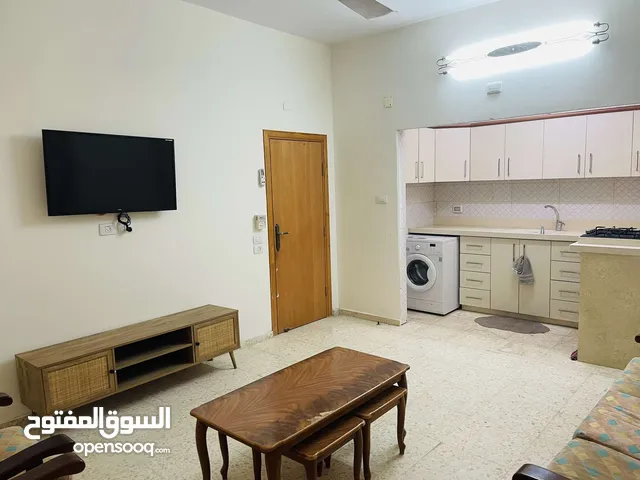 شقة مفروشة للإيجار Ground floor apartment with a front garden for rent on Al-Mala'ab Street in Qalqi