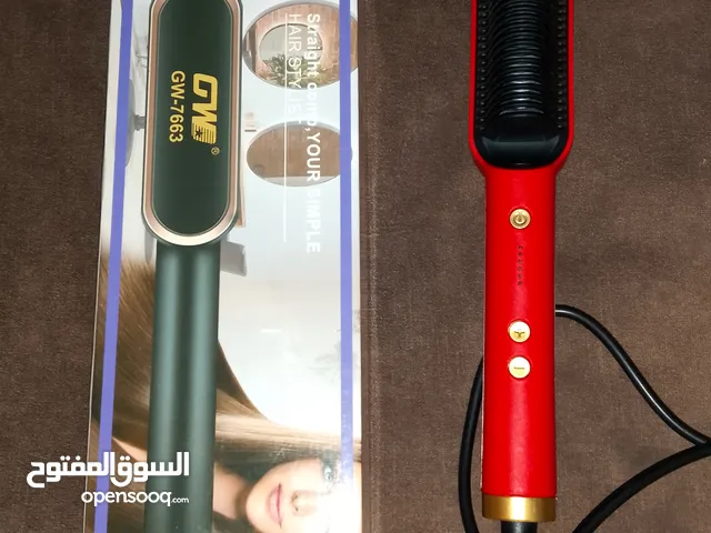 مشط مكواة شعر كهربائي